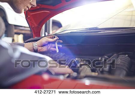 Close up mechanic with tool working on engine View Large Photo Image Stock Image - Close up mechanic with tool working on engine. Fotosearch