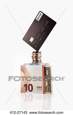 Credit card balancing on coins and cash View Large Photo Image Stock Image - Credit card balancing on coins and cash. Fotosearch