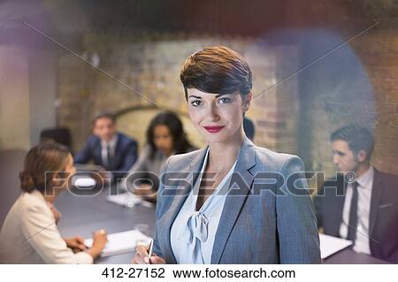 Stock Image - Portrait confident businesswoman in conference room meeting. Fotosearch