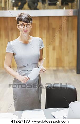 Portrait confident businesswoman in office View Large Photo Image Stock Image - Portrait confident businesswoman in office. Fotosearch
