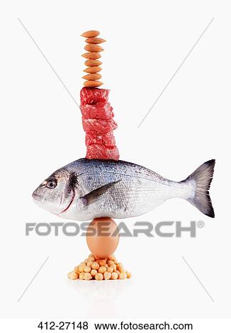 Raw healthy foods balancing View Large Photo Image Stock Photo - Raw healthy foods balancing. Fotosearch