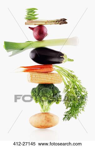 Raw vegetables balancing View Large Photo Image Stock Photography - Raw vegetables balancing. Fotosearch
