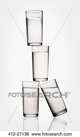 Stock Photo - Stacked water glasses balancing. Fotosearch