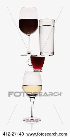 Stock Image - Wine, water and espresso glasses balancing. Fotosearch