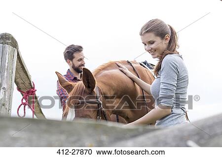 Couple with horse View Large Photo Image Stock Image - Couple with horse. Fotosearch