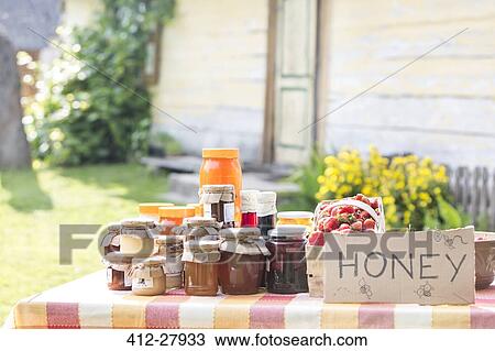 Fresh jars of honey at farmer’s market stall View Large Photo Image Stock Image - Fresh jars of honey at farmer’s market stall. Fotosearch
