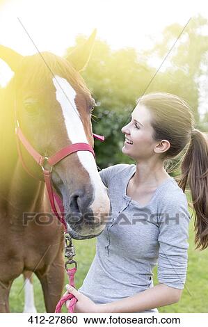 Smiling woman with horse View Large Photo Image Stock Image - Smiling woman with horse. Fotosearch