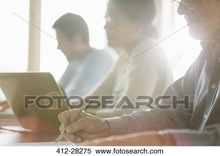 Business people in meeting View Large Photo Image Stock Photography - Business people in meeting. Fotosearch