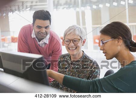 Business people working at computer in office View Large Photo Image Stock Photo - Business people working at computer in office. Fotosearch
