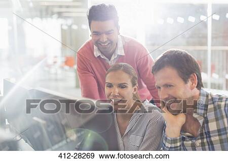Business people working at computer in office View Large Photo Image Stock Photo - Business people working at computer in office. Fotosearch