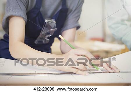 Carpenter drafting plans with pencil and ruler View Large Photo Image Stock Photo - Carpenter drafting plans with pencil and ruler. Fotosearch