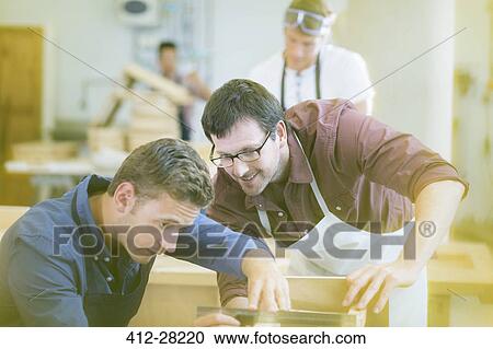 Carpenters working in workshop View Large Photo Image Stock Image - Carpenters working in workshop. Fotosearch