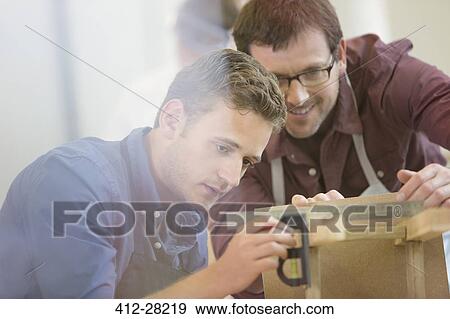 Carpenters working in workshop View Large Photo Image Stock Photo - Carpenters working in workshop. Fotosearch