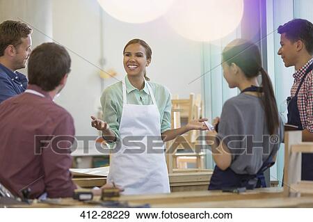 Carpentry teacher leading lesson in workshop View Large Photo Image Stock Photo - Carpentry teacher leading lesson in workshop. Fotosearch