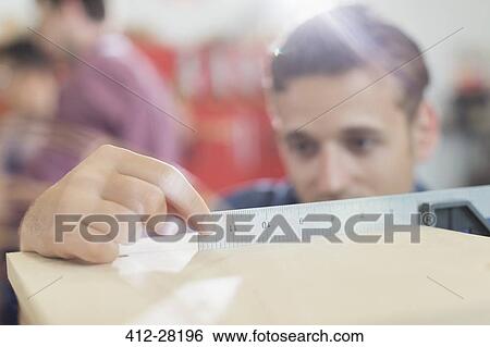 Close up carpenter measuring wood with ruler View Large Photo Image Stock Photograph - Close up carpenter measuring wood with ruler. Fotosearch