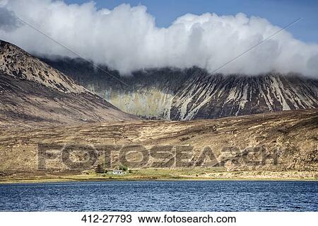 Stock Image - Clouds over mountains, Scotland. Fotosearch