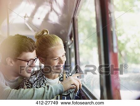 Couple drawing on bus window View Large Photo Image Stock Photo - Couple drawing on bus window. Fotosearch