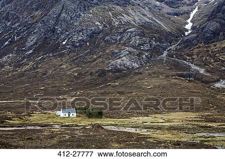 House in remote valley below craggy mountains, Glencoe, Scotland View Large Photo Image Stock Photo - House in remote valley below craggy mountains, Glencoe, Scotland. Fotosearch