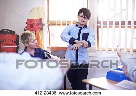 Instructor guiding students on making medical splint in training class View Large Photo Image Stock Photograph - Instructor guiding students on making medical splint in training class. Fotosearch