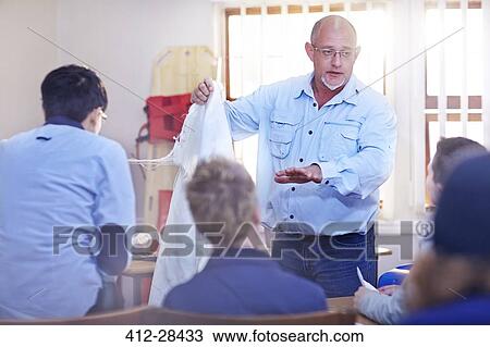Instructor leading medical training class View Large Photo Image Stock Image - Instructor leading medical training class. Fotosearch