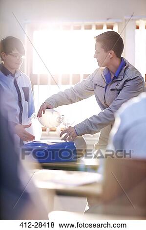 Instructor with manual resuscitator teaching CPR class View Large Photo Image Stock Photo - Instructor with manual resuscitator teaching CPR class. Fotosearch