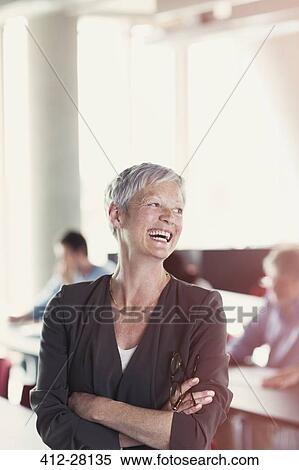 Laughing senior woman in adult education classroom View Large Photo Image Stock Photography - Laughing senior woman in adult education classroom. Fotosearch