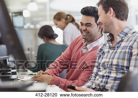 Men laughing at computer in adult education classroom View Large Photo Image Stock Image - Men laughing at computer in adult education classroom. Fotosearch