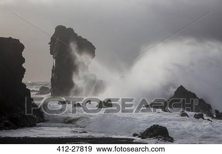 Stock Photo - Ocean waves crashing against rock formations, Londrangar, Snaefellsnes, Iceland. Fotosearch