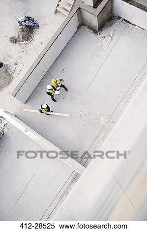 Overhead view of construction workers at construction site View Large Photo Image Stock Photography - Overhead view of construction workers at construction site. Fotosearch