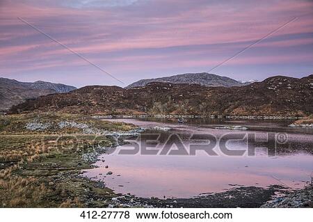 Pink sunrise sky over Badcall Bay, Sutherland, Scotland View Large Photo Image Stock Photo - Pink sunrise sky over Badcall Bay, Sutherland, Scotland. Fotosearch