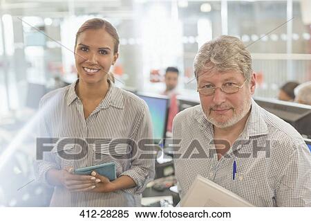 Stock Photography - Portrait confident business people in office. Fotosearch
