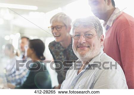 Portrait confident businessman in meeting View Large Photo Image Stock Photography - Portrait confident businessman in meeting. Fotosearch