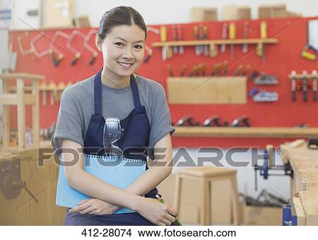 Picture - Portrait confident carpenter in workshop. Fotosearch