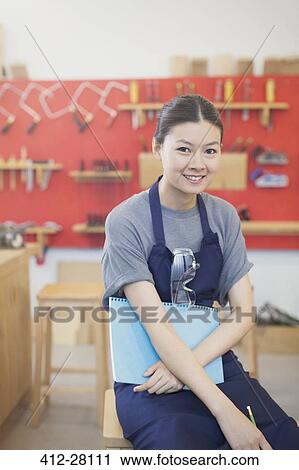 Portrait confident female carpenter in workshop View Large Photo Image Stock Image - Portrait confident female carpenter in workshop. Fotosearch