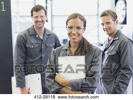 Portrait confident female mechanic with clipboard in auto repair shop View Large Photo Image Stock Photo - Portrait confident female mechanic with clipboard in auto repair shop. Fotosearch