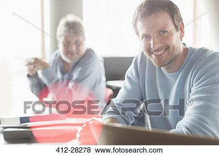 Portrait confident man in adult education classroom View Large Photo Image Stock Photo - Portrait confident man in adult education classroom. Fotosearch