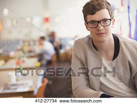 Portrait confident man with eyeglasses in cafe View Large Photo Image Picture - Portrait confident man with eyeglasses in cafe. Fotosearch