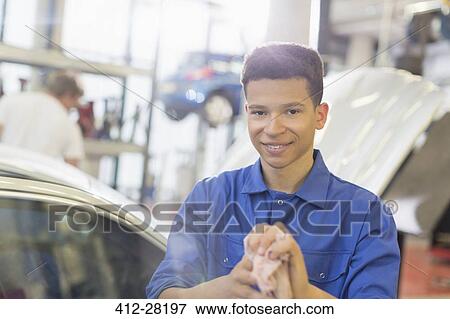 Stock Photo - Portrait confident mechanic in auto repair shop. Fotosearch
