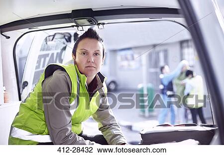 Stock Image - Portrait confident rescue worker in ambulance. Fotosearch