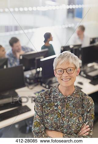 Portrait confident senior woman in adult education computer classroom View Large Photo Image Stock Photography - Portrait confident senior woman in adult education computer classroom. Fotosearch