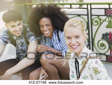 Stock Photograph - Portrait smiling friends outdoors. Fotosearch