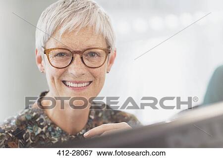 Portrait smiling senior businesswoman with eyeglasses View Large Photo Image Stock Photo - Portrait smiling senior businesswoman with eyeglasses. Fotosearch