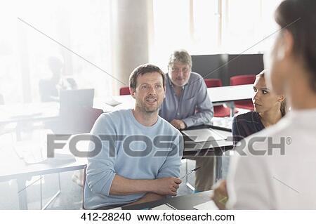 Professor and students talking in adult education classroom View Large Photo Image Stock Image - Professor and students talking in adult education classroom. Fotosearch