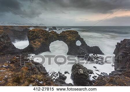 Stock Photography - Rock formations among stormy ocean, Amarstapi, Snaefellsnes, Iceland. Fotosearch