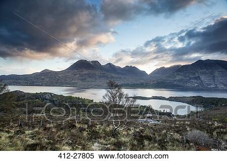 Scenic view clouds over calm mountains and lake, Russel Burn, Applecross, Scotland View Large Photo Image Stock Photography - Scenic view clouds over calm mountains and lake, Russel Burn, Applecross, Scotland. Fotosearch