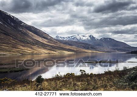 Stock Image - Scenic view of mountains and lake, Isle of Skye, Scotland. Fotosearch