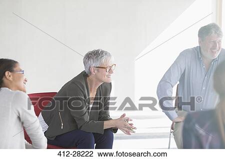 Smiling business people in meeting View Large Photo Image Stock Image - Smiling business people in meeting. Fotosearch