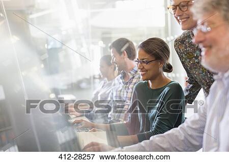 Students at computers in adult education classroom View Large Photo Image Stock Photo - Students at computers in adult education classroom. Fotosearch