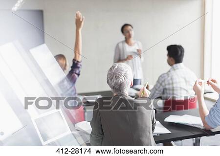 Picture - Teacher and students in adult education classroom. Fotosearch