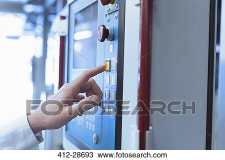 Close up of worker at control panel in factory View Large Photo Image Stock Image - Close up of worker at control panel in factory. Fotosearch